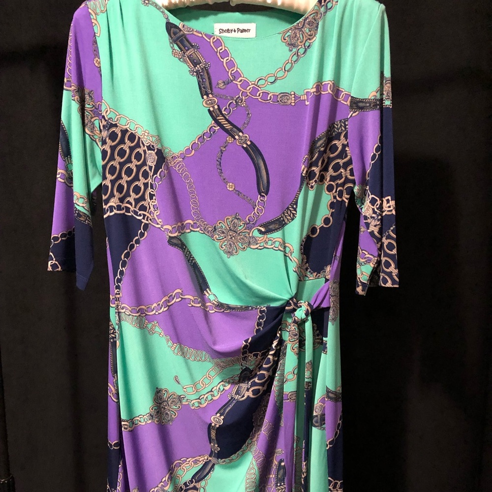 Faux wrap dress with chain print design